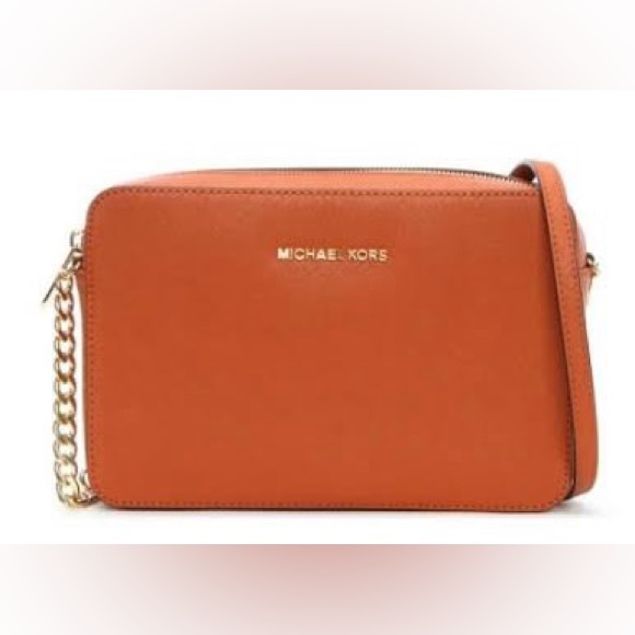 Michael Kors Handbags - New Michael Kors small bag. I have even open the wrapping papers.